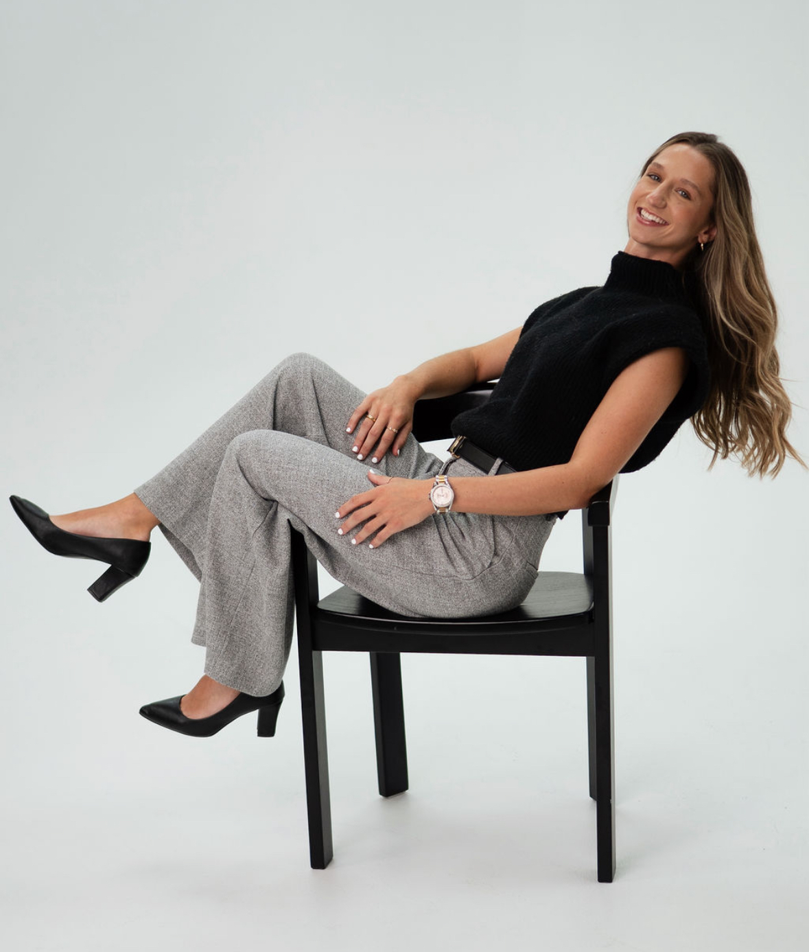 Candid portrait of Keely seated, laughing